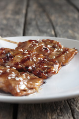 Thai food grilled pork on Wooden floor