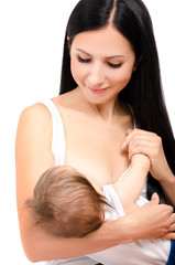 Portrait of a beautiful young mother breastfeeding her baby