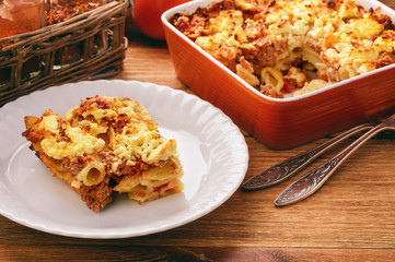 Pastitsio -greek casserole with pasta, meat, tomatoes and feta cheese.