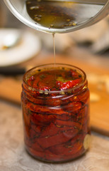 Sun-dried tomatoes in a glass jar.
