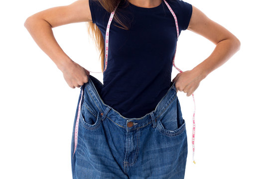 Woman wearing jeans of much bigger size