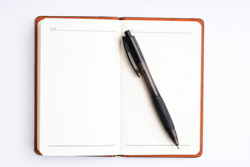 notepad with pen isolated