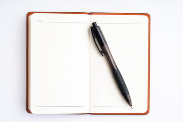 notepad with pen isolated