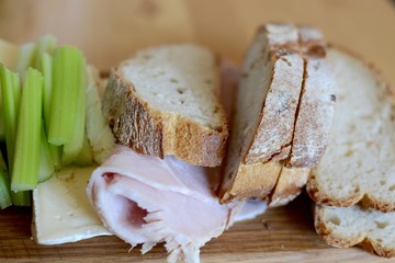 Artisan bread board with cheese, ham and celery
