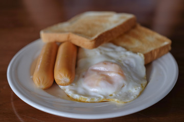 Breakfast for healthy in the morning Fresh egg with sausage and  Grilled bread  Sandwich 