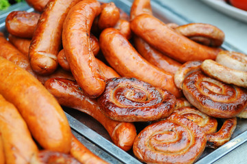 Fresh grilled sausages and welts in heap. Heap of Fresh sausage. Fresh grilled sausages and welts in heap. Close up