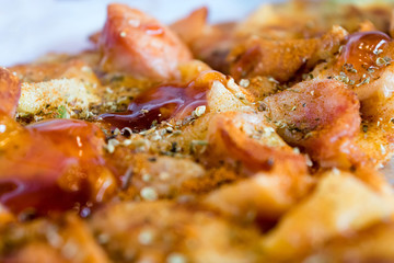 Photo, appetizing pizza with sausage, cheese, tomatoes and mayon