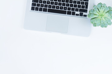 Laptop and phone on white table mock up flat lay scene with succulents zen style, copy space on...
