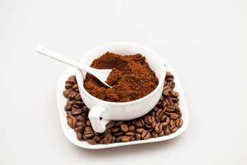 White objects, coffee beans and coffee powder with details