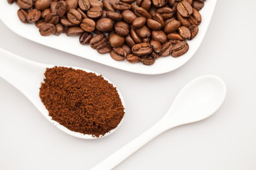 White objects, coffee beans and coffee powder with details