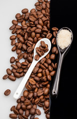 Coffee beans, brown sugar and small teaspoons
