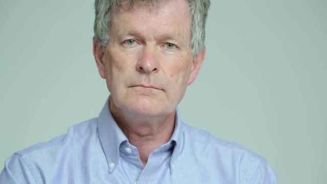Depressed, sad man shrugs