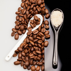 Coffee beans, brown sugar and small teaspoons