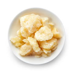 Bowl of parmesan cheese isolated on white background
