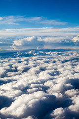 Fototapeta na wymiar Beautiful, dramatic clouds and sky viewed from the plane. High resolution and quality