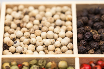 Different types of pepper: red, green dark and white