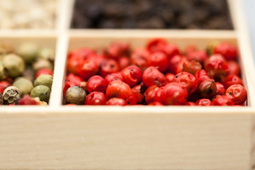 Different types of pepper: red, green dark and white