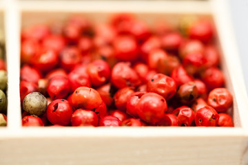 Different types of pepper: red, green dark and white