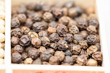 Different types of pepper: red, green dark and white