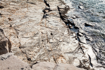 Aegean seashore and marble rocks in Aliki, Thassos island, Greece