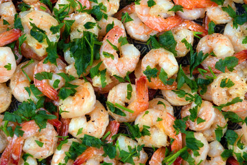 Shrimp in a creamy garlic sauce with butter and parsley.