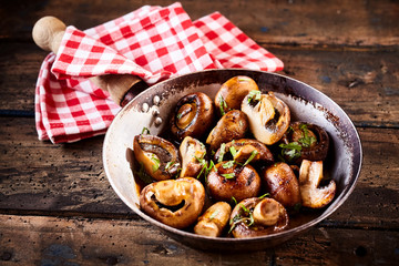 Whole crimini mushrooms in stir fry pan