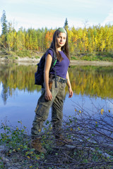 Fototapeta na wymiar Travel along the coast taiga autumn river in Russia