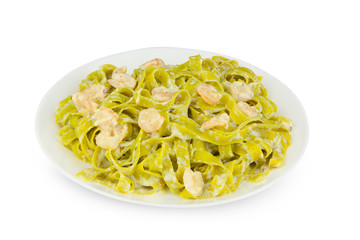 delicious green tagliatelle isolated on white