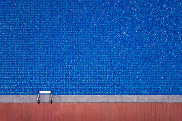 Top view of beg swimming pool. Blue water background.