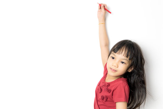 Asian Girl Is Writing On A White Background Copy Space