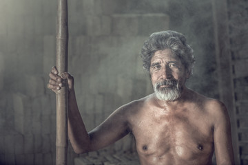 portrait of an elderly man on black background