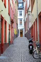 urban landscape with narrow streets, houses and cobbled pavement