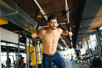 Fototapeta na wymiar Bodybuilder working out in gym