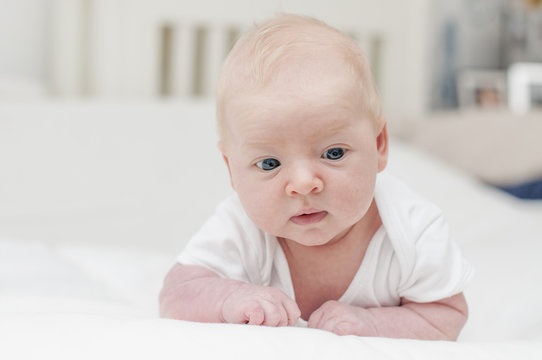 Cute adorable newborn baby with blue eyes portrait