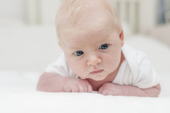 Cute adorable newborn baby with blue eyes portrait