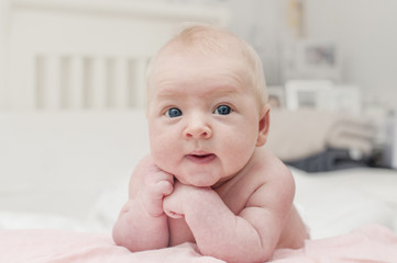 Cute adorable newborn baby with blue eyes portrait