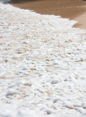 Sea wave and sandy beach