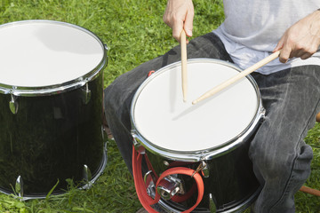Hands of Drummers Playing Outdoors