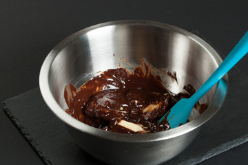 Melted Dark Chocolate And Butter In Bowl. Cooking Process Of Bro