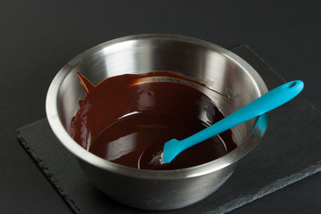 Melted Dark Chocolate In Bowl. Cooking Process Of Brownies.