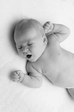 Cute adorable newborn baby yawning portrait