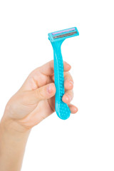 Hand holds a blue shaver. On white, isolated background.