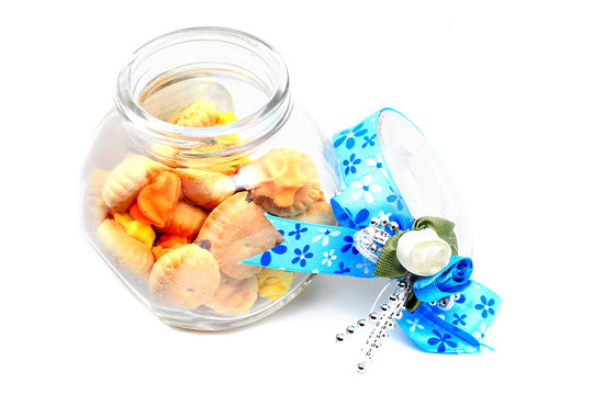 Meringue Button Cookies in the bottle with blue ribbon for gift