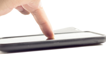 Hand touching screen on modern mobile smart phone