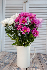 beautiful chrysanthemum in a vase in the style of Provence