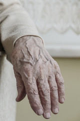 wrinkled hand of a senior person