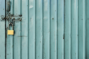 Green zinc Door with key locked photo