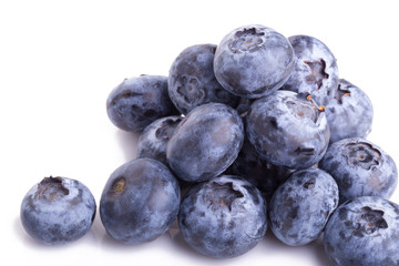 close up of blueberries on white background