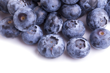 close up of blueberries on white background