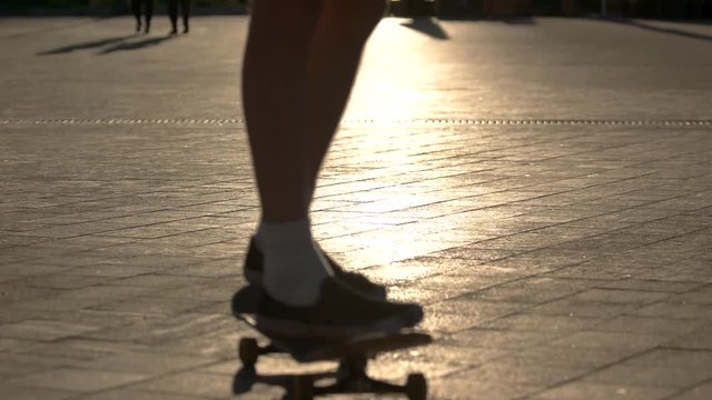 Skateboard in motion. Shadow of skater. Speed and maneuvers. Imagine the obstacle.